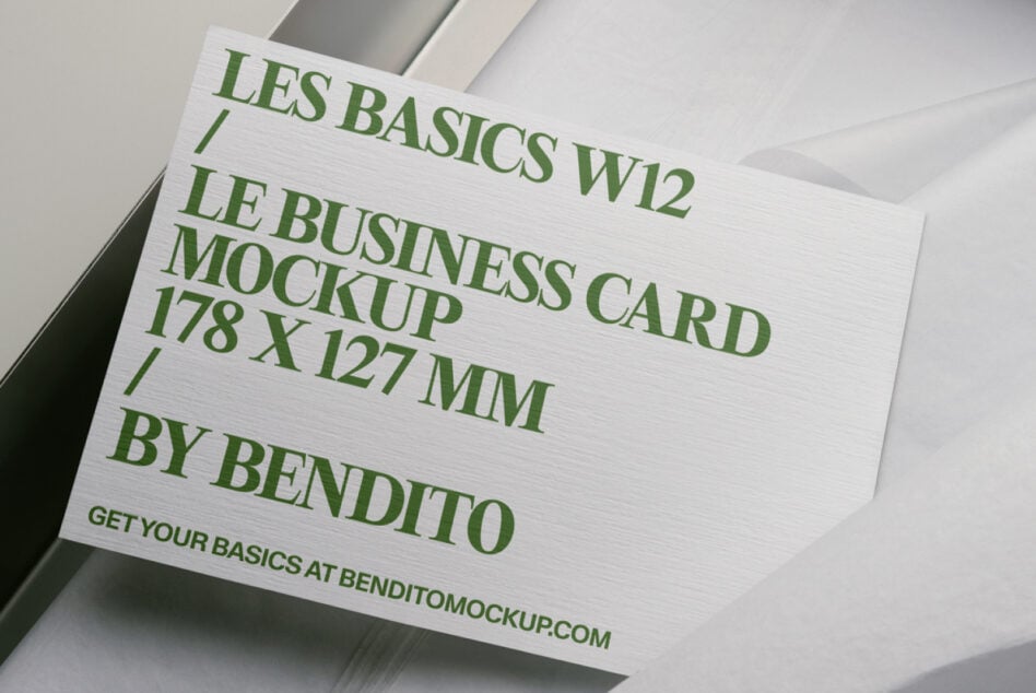White business card mockup with green text in minimalist box display