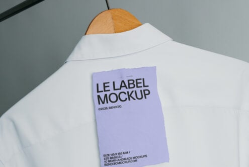 Lavender label mockup sewn onto white shirt front shown on hanger