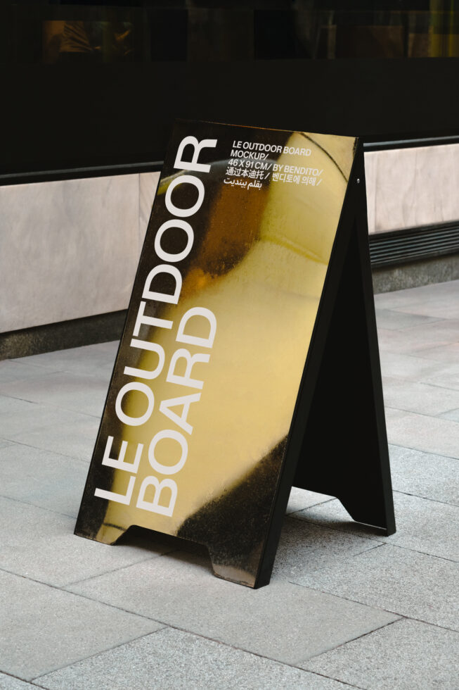 Yellow outdoor board mockup with white text on pavement display