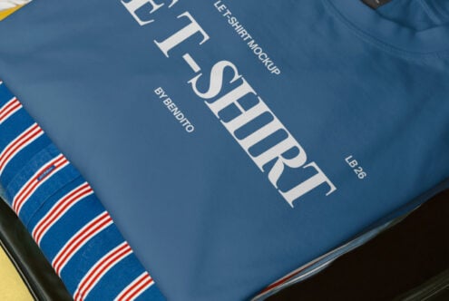 Close-up of blue t-shirt print showing serif text design on fabric