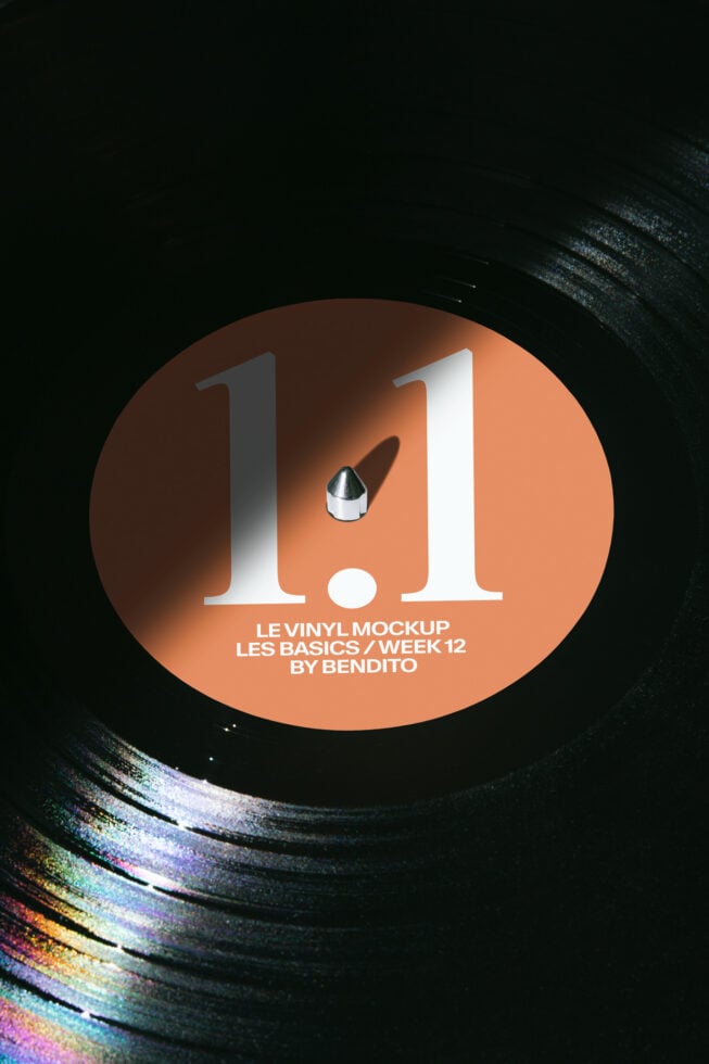 Orange vinyl record with 1.1 title, colorful glitch effect on dark