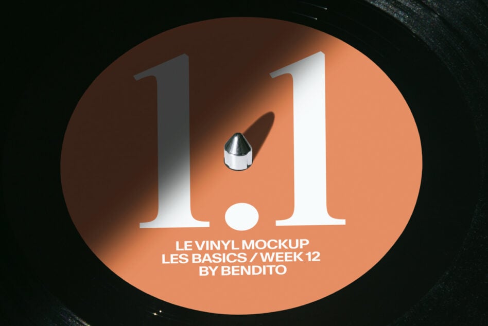 Orange vinyl record with 1.1 title, colorful glitch effect on dark