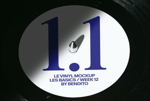 Vinyl record mockup with navy blue numbers on white label with needle detail