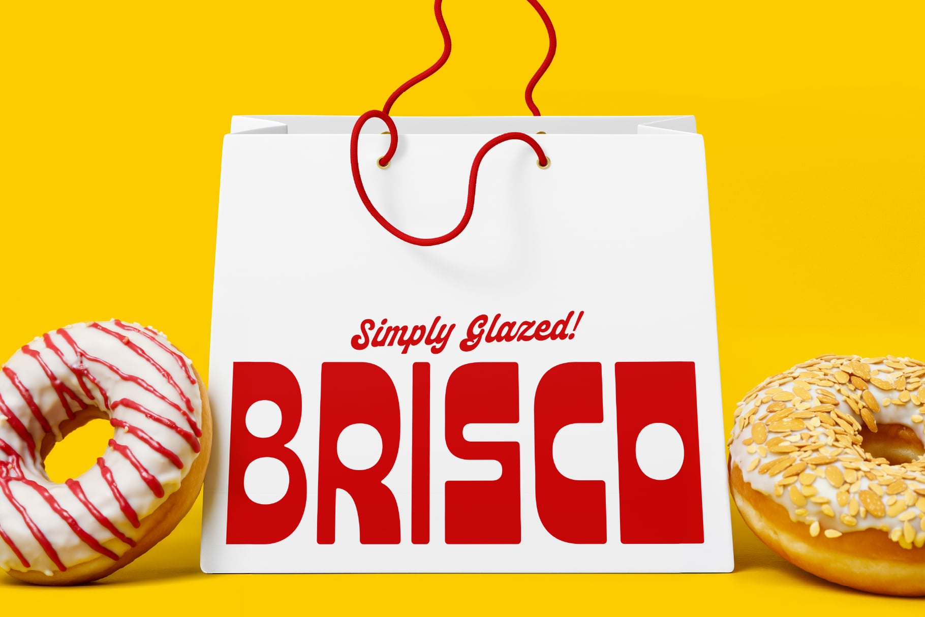 White shopping bag with Simply Glazed BREAD text in red on bright yellow background with donuts