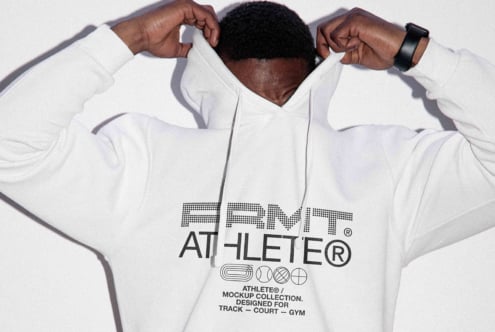 Back view of white hoodie arms stretched up revealing bold branding on back