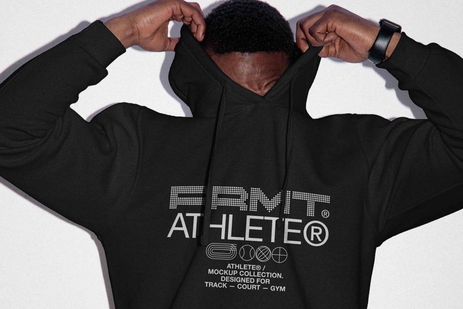 Back view of black hoodie with arms pulling fabric up showing large print