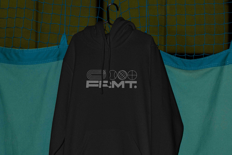 Black hoodie on hanger displaying back logo with geometric shapes design