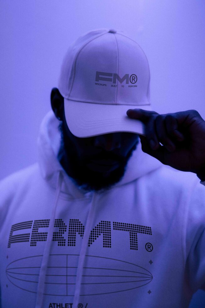 White hoodie hooded sweatshirt with FRMT branding against purple neon lighting