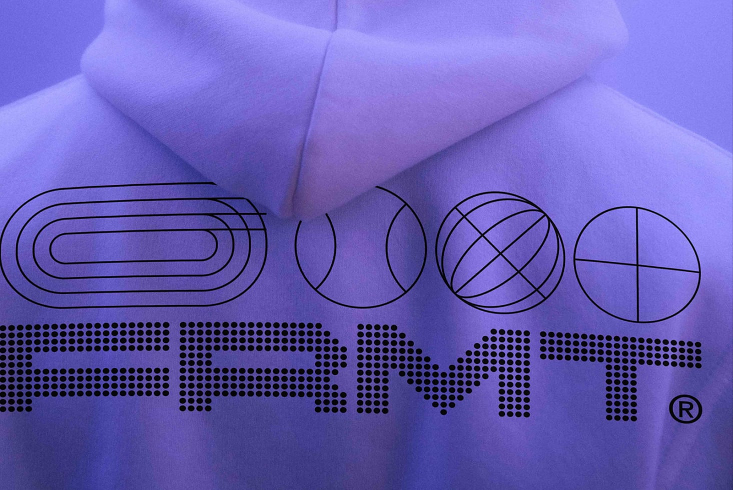 Purple fabric with geometric line shapes, FRMT branding in halftone dots below