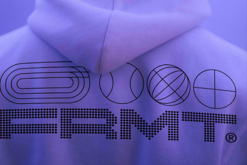 Purple fabric with geometric line shapes, FRMT branding in halftone dots below