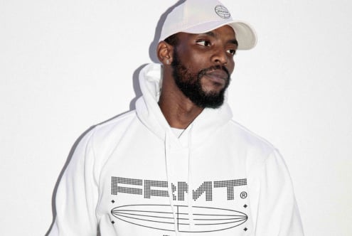 Man modeling white hoodie with geometric surfboard print mockup