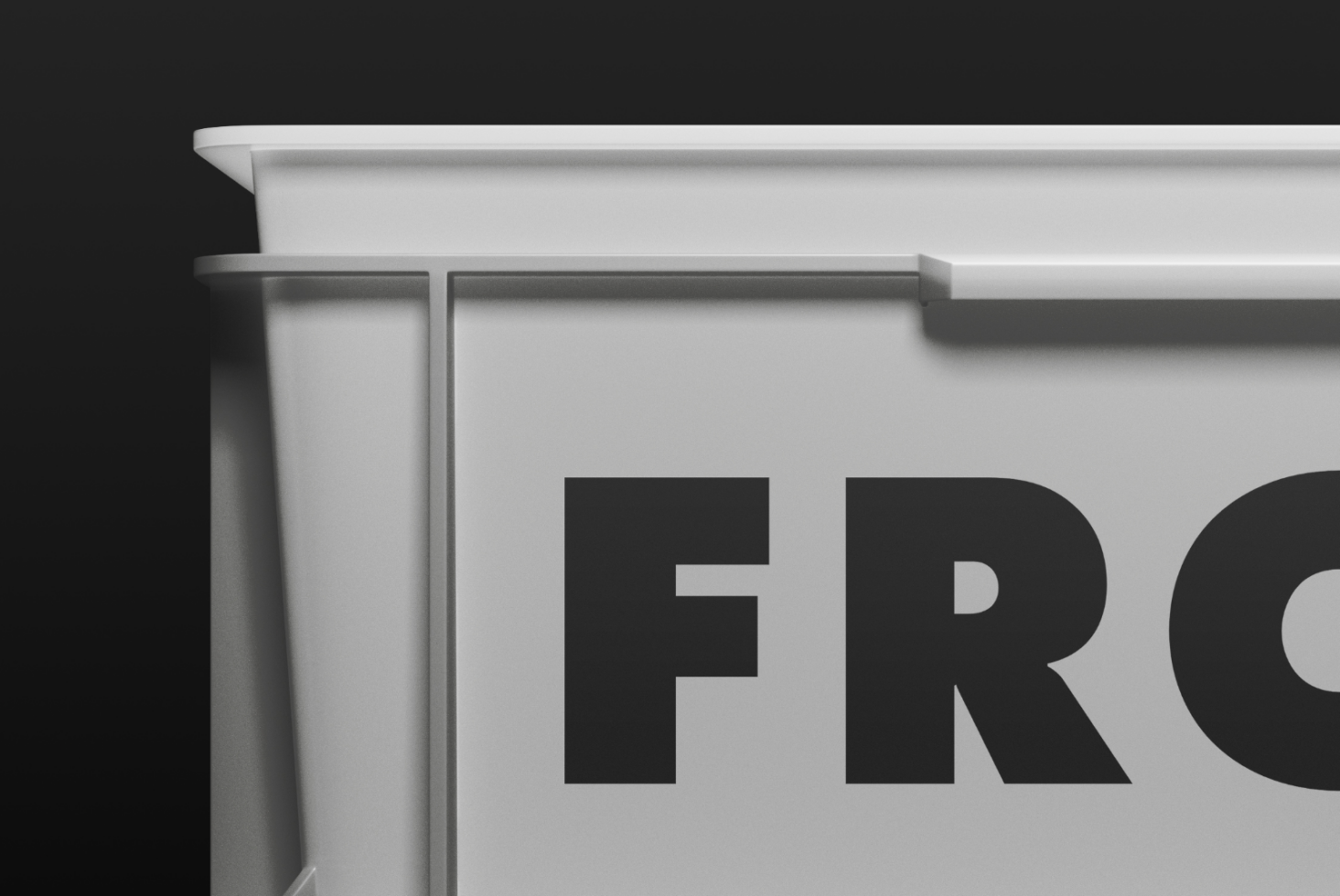 Minimalist white shelf edge showing partial black text on dark background
