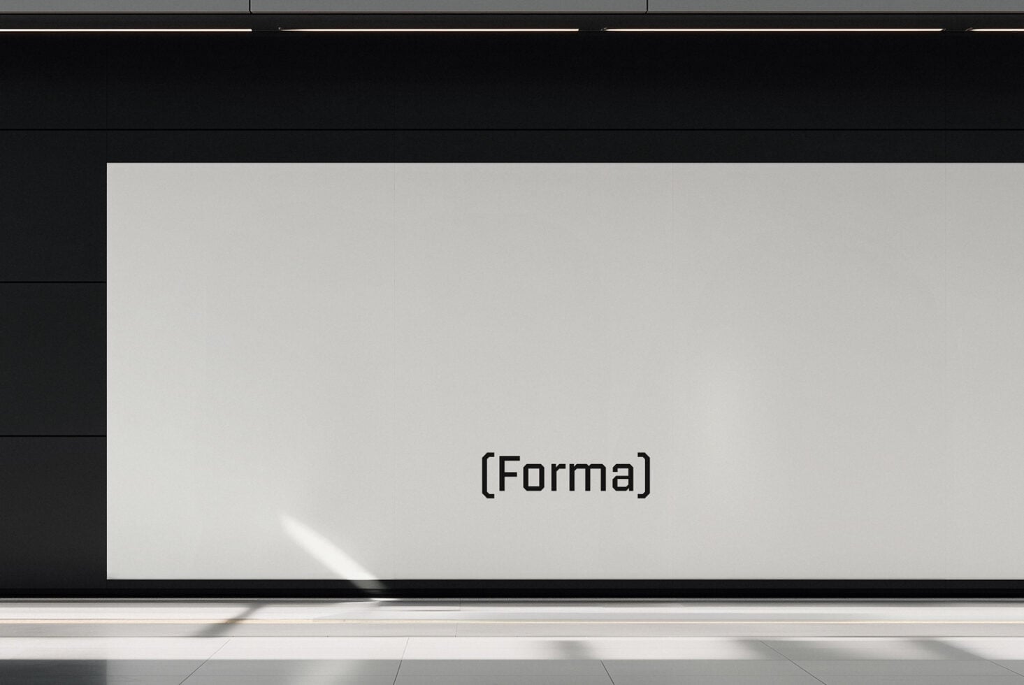 Blank light grey screen mockup mounted on gallery wall with minimal text overlay