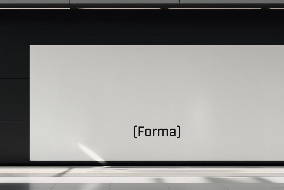 Blank light grey screen mockup mounted on gallery wall with minimal text overlay