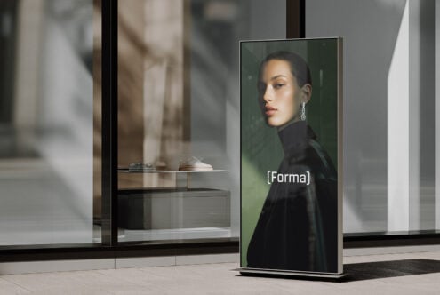 Tall portrait display mockup with woman in black turtleneck against green
