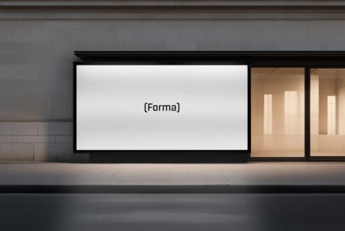 Shop window with blank white display screen between wooden interior spaces