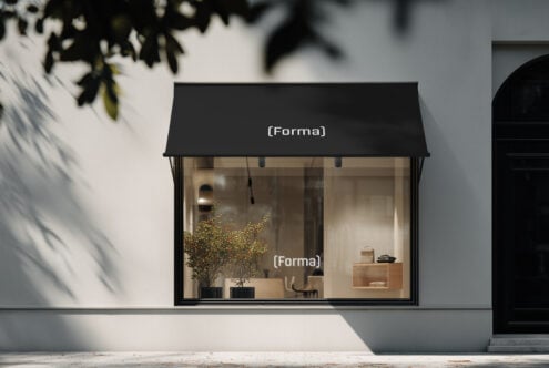 Minimal retail storefront mockup with black awning on sunny street