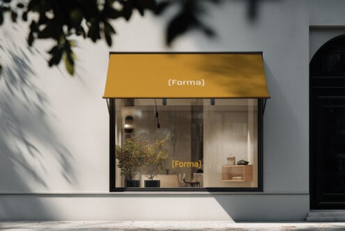 Retail storefront mockup with mustard yellow awning in daylight