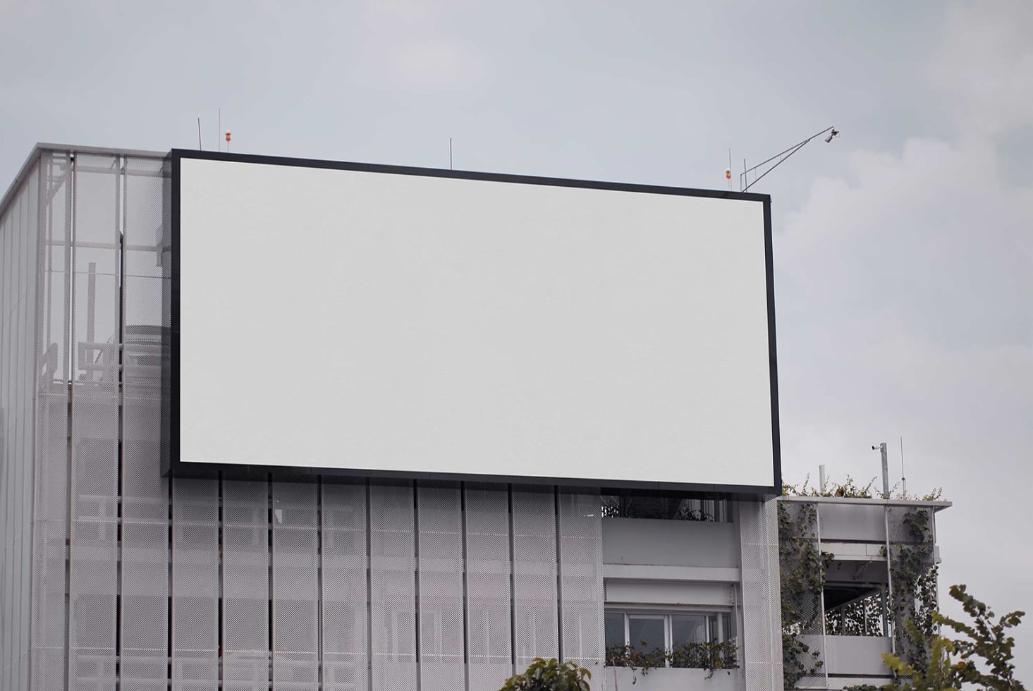 Empty billboard on concrete building exterior ready for design placement
