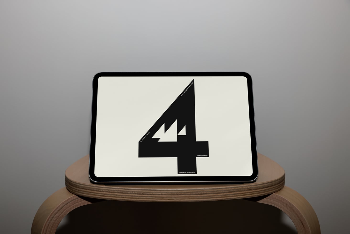 Tablet on wooden stand showing bold black number 4 with lightning bolt detail