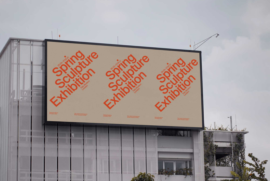 Billboard displaying Spring Sculpture Exhibition in bold red typography