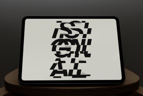 Tablet mockup showing geometric typography layout on white background