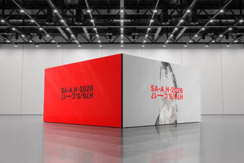 Red box mockup with text on red wall in modern warehouse