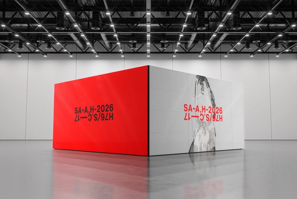 Red box mockup with text on red wall in modern warehouse