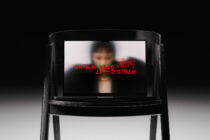 Black wood chair mockup showing blurred portrait with red text overlay