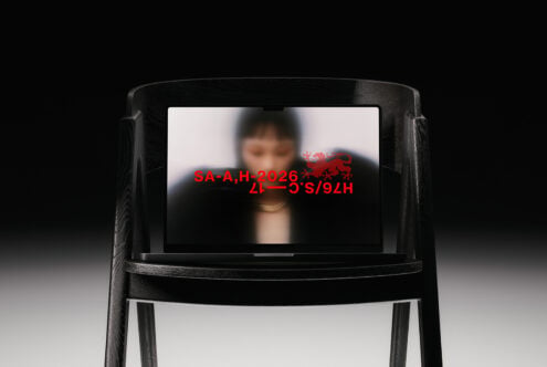 Black wood chair mockup showing blurred portrait with red text overlay