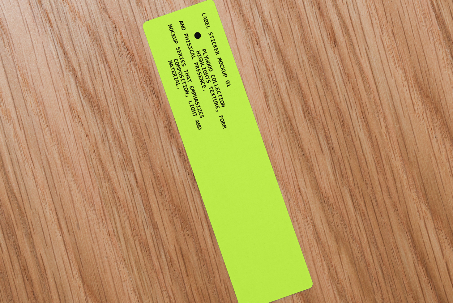 Neon yellow narrow label sticker on wood angled showing full text layout design