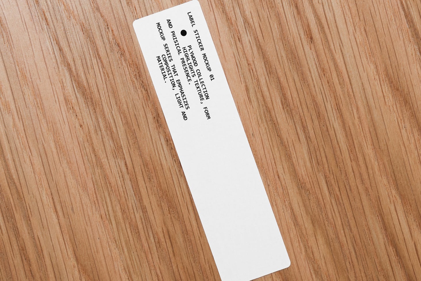 White narrow label sticker on wood angled showing full text layout design