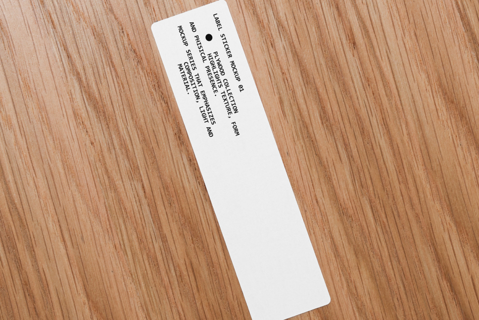 White narrow label sticker on wood angled showing full text layout design