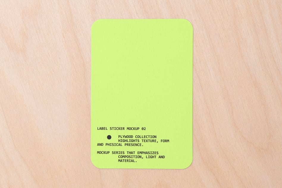 Neon yellow rounded square sticker on light wood with text centered bottom