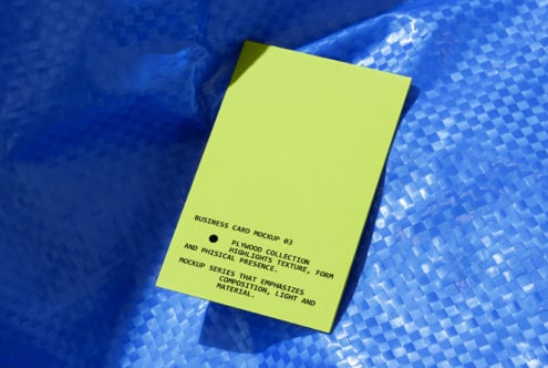 Neon yellow business card mockup on blue textured background