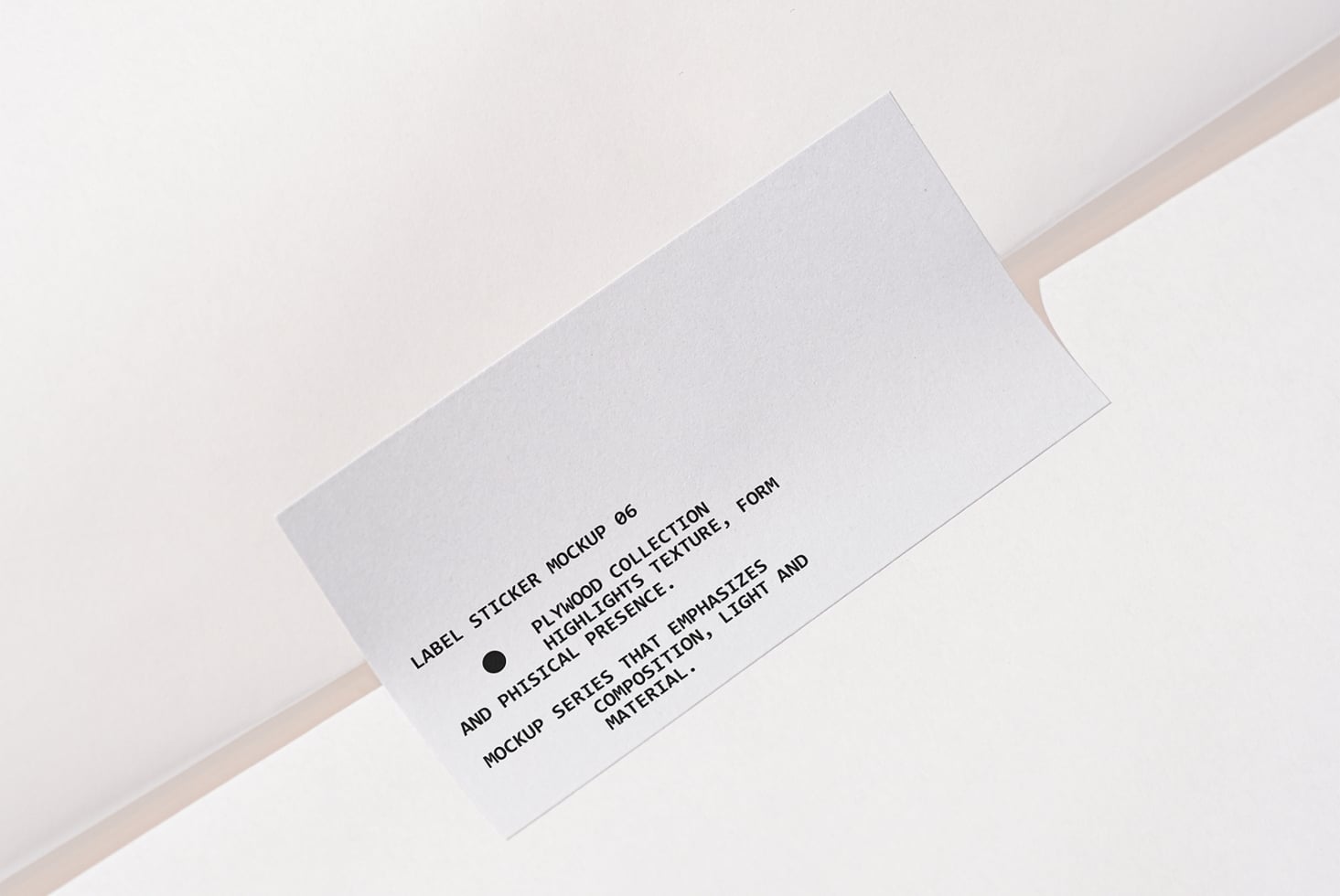 White label sticker on white background with black text copy angled view