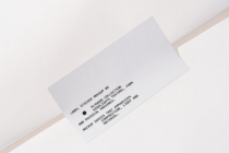 White label sticker on white background with black text copy angled view