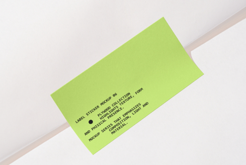 Bright lime green label sticker on white background with black text copy