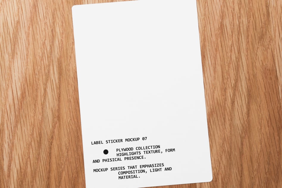 White label sticker on wooden table with black text angled shot overhead
