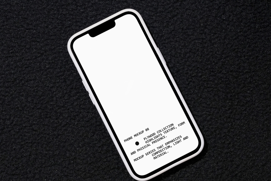 iPhone mockup angled on dark speckled background with blank white screen