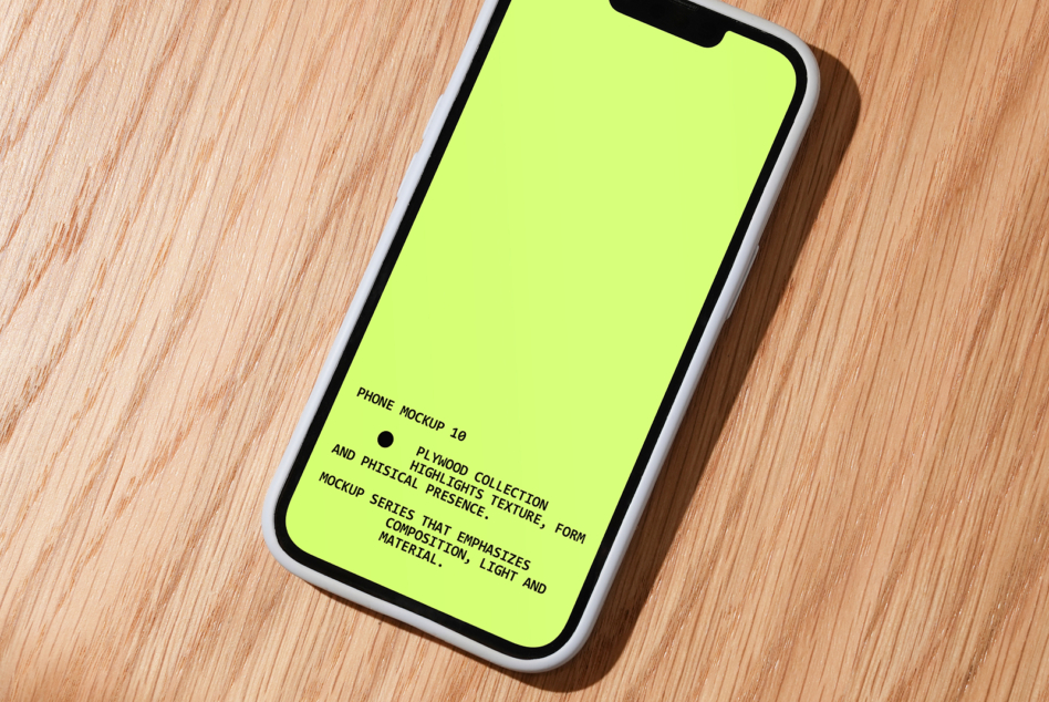 iPhone mockup on wood table with neon yellow screen, shot from above angle