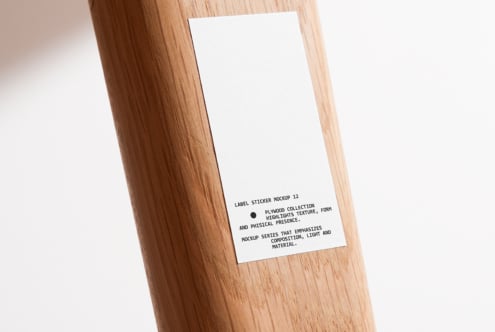White square label sticker on wooden post mockup with soft shadows