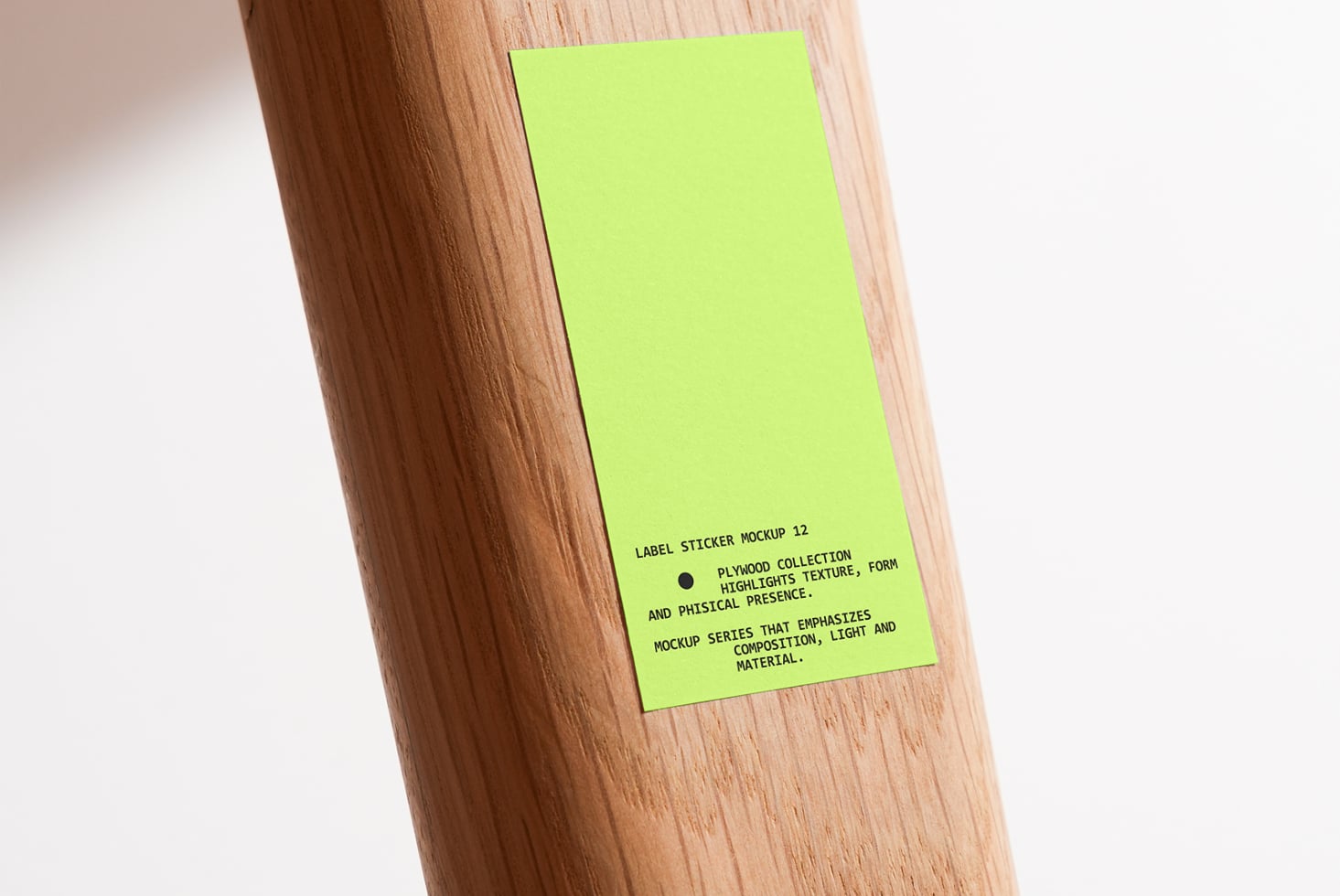Large neon green sticker on natural wood pole with natural lighting