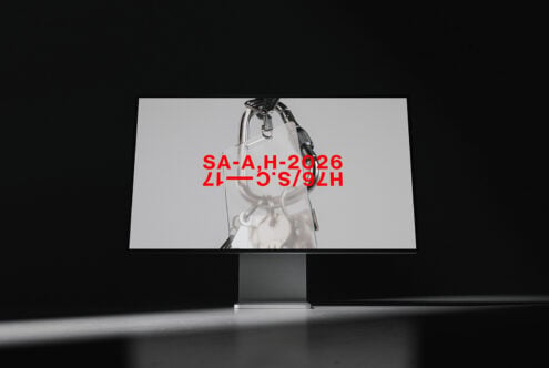Monitor mockup displaying red text overlay on lab equipment photography