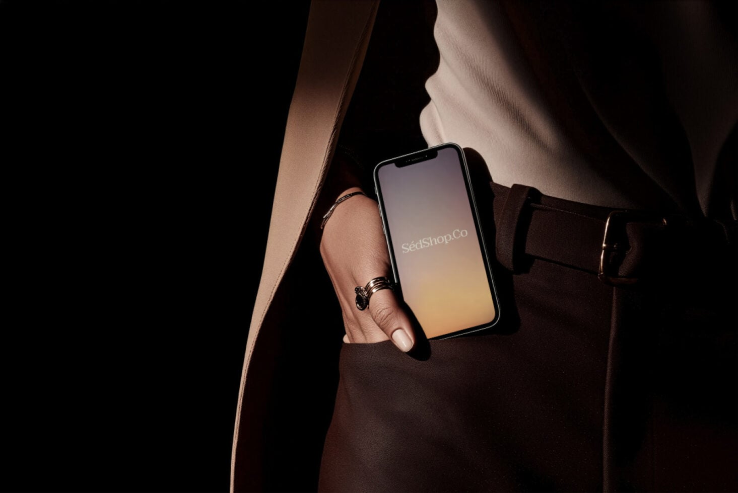 iPhone display showing soft peach-to-gold gradient with SédShop.Co text on dark background