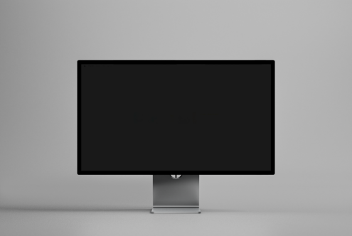 Minimalist desktop monitor mockup on gray background ideal for showcasing web designs or applications in a modern workspace setting.
