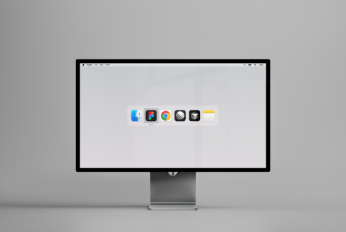 Minimalist computer monitor mockup displaying a clean interface with app icons on a gray background. Ideal for showcasing UI designs and digital products.