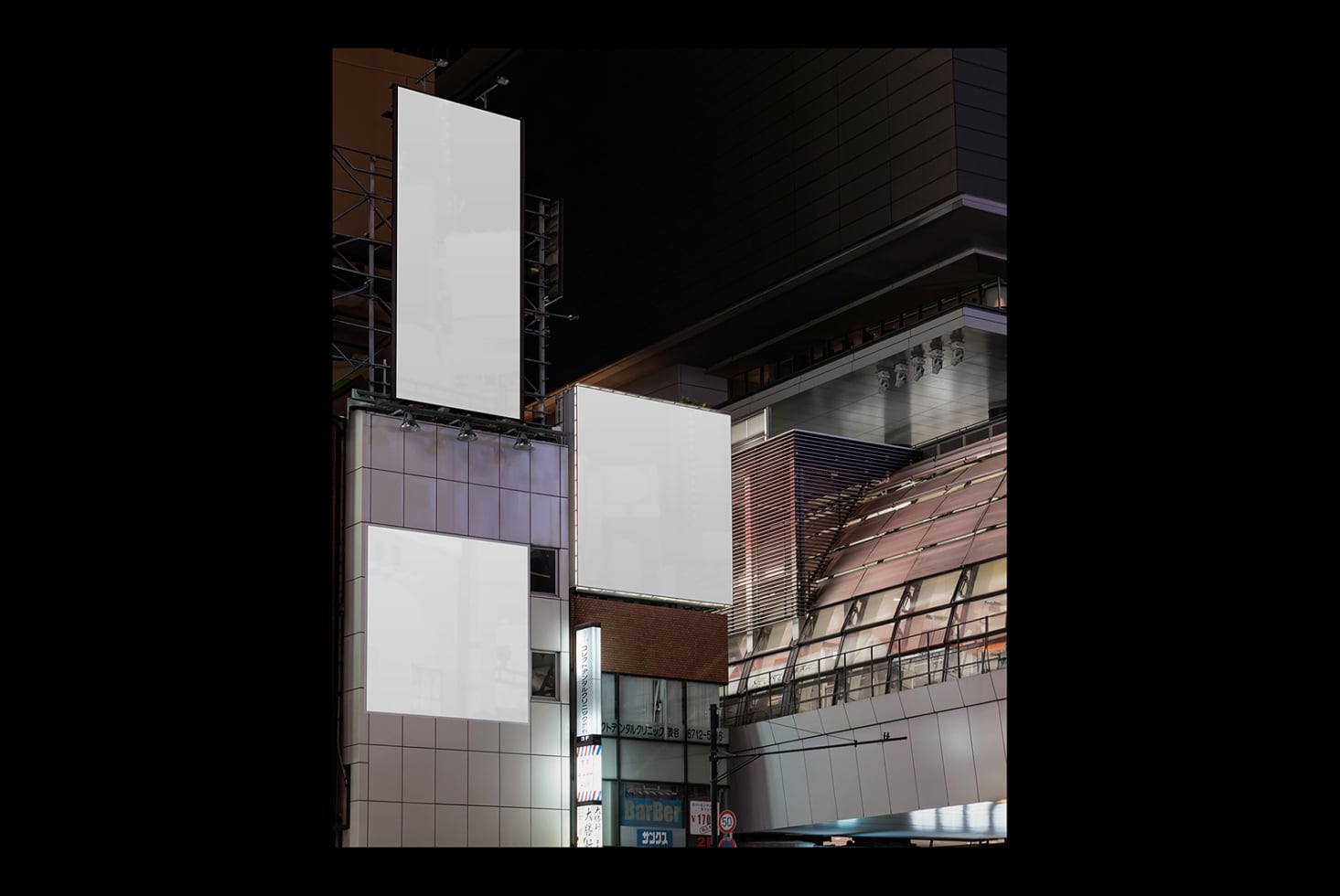 White vertical billboard on metal frame above Tokyo street storefront