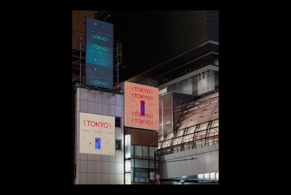 Tall digital signage tower Tokyo night showing teal, cream, coral graphic designs