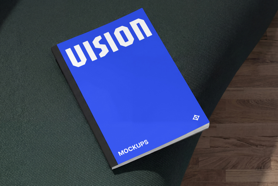 Bright blue hardcover book with white Illusion text on fabric material background